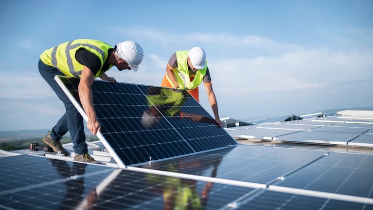 Installing solar panels on a roof Original publisher image. Republication permission/licence not verified.